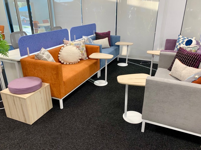 Couches in orange, blue and grey