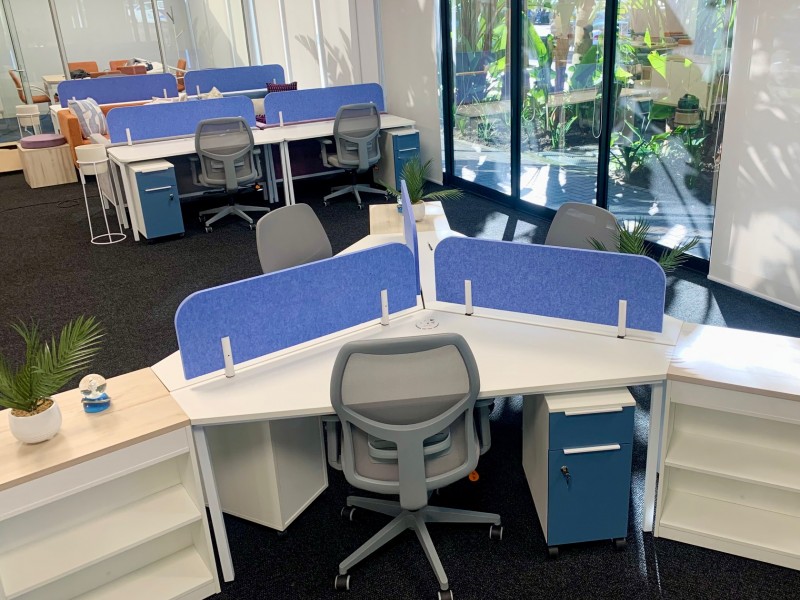 White desks with blue screens